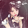 jjangwonrei_sha758: a photo of ive wonyoung jang on a burgundy background surrounded by a deathbat, a logo with a skull having bat wings (a7x band logo) and a silver heart with an orbit! (wonwon1)