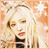 jjangwonrei_sha758: An icon featuring Liz/Kim Jiwon of IVE. She has long blonde hair with bangs and fluffy antlers as a hair accessory. The background is a bright orange with sparkles and the text caption above says "REBEL" in capitalized letters. (lizzie)